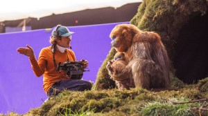 THE LEGEND OF OCHI, director Evan Prosofsky, with Ochi, on set, 2025. © A24 /Courtesy Everett Collection