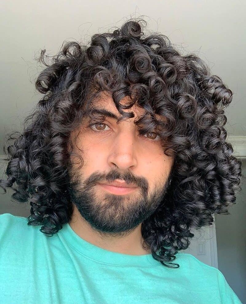man with long and curly hair