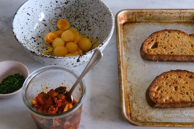 Ingredients needed to make deviled egg toast on a kitchen counter