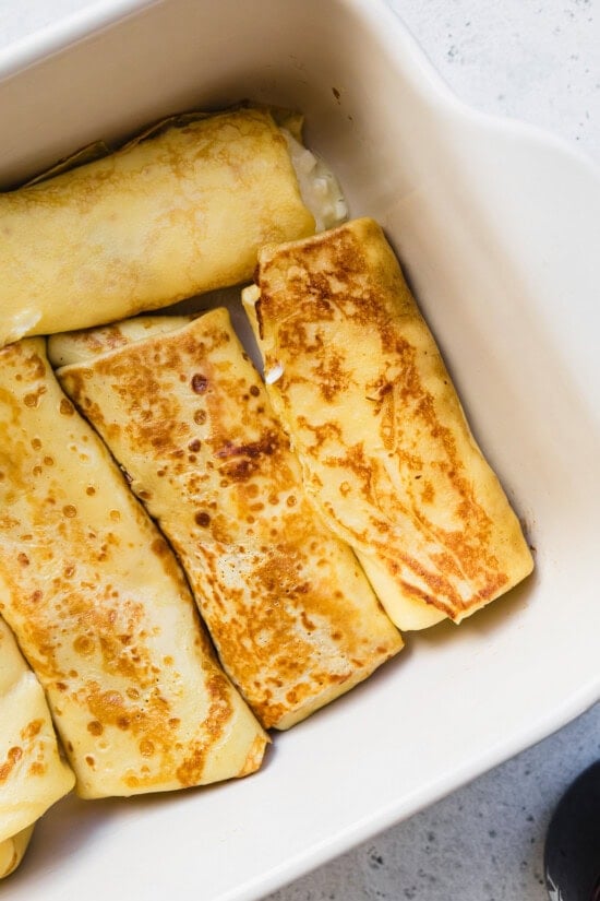 Cooked blintzes in a baking dish