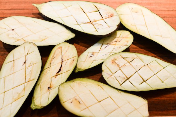 Score the eggplant flesh