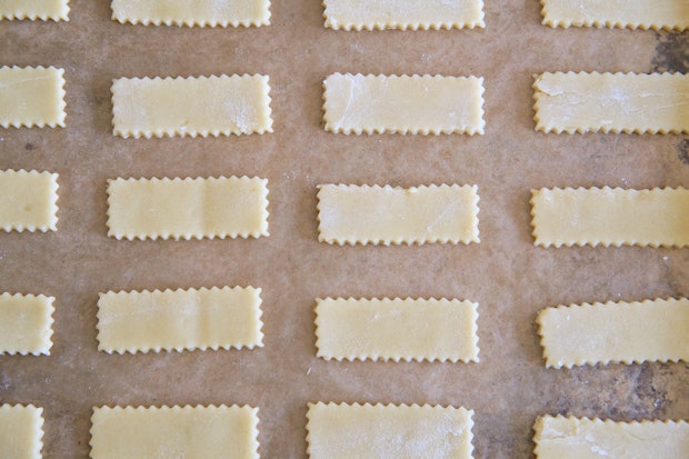 sugar cookie dough on a parchment lined baking sheet