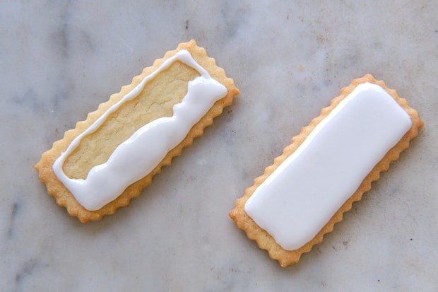 the process of sugar cookies being flooded with royal icing