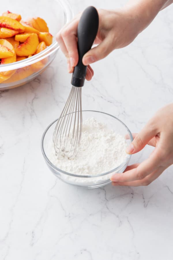 Whisking cornstarch in with sugar for the pie filling.