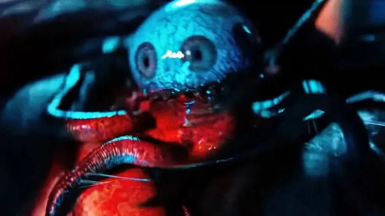 Species 64 bathed in red light in Alien: Earth